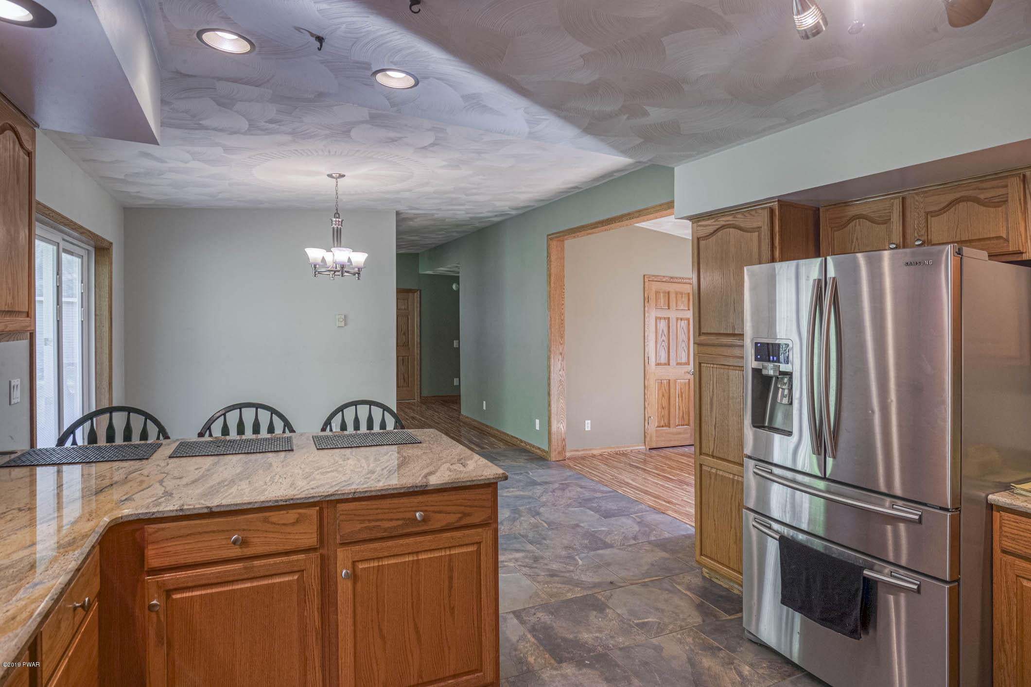 424 Old Gravity Road Lake Ariel, PA 18436 - Photo 8 of 46 a kitchen with stainless steel appliances a refrigerator and a sink
