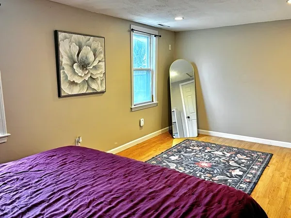 a bedroom with a bed and closet