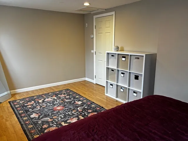 a bedroom with a bed and closet