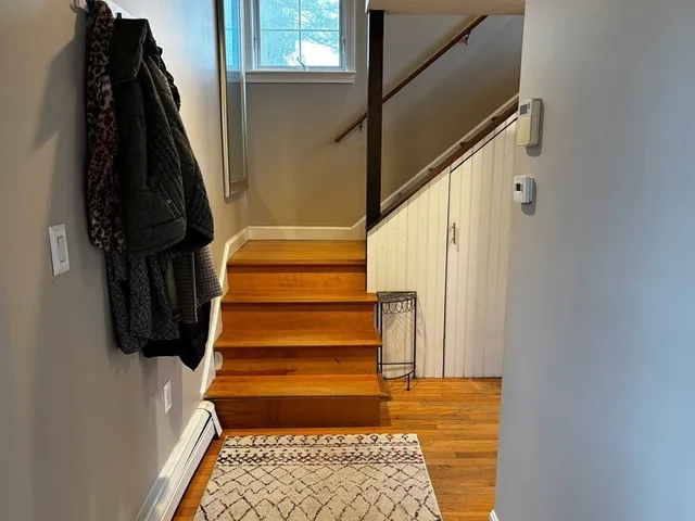 a view of entryway with wooden floor