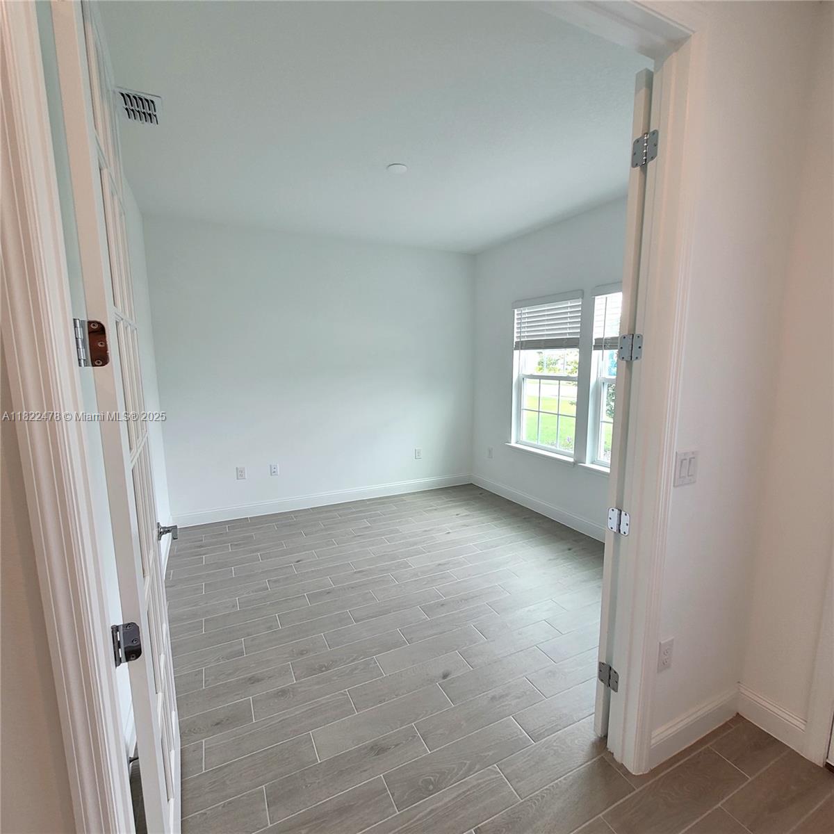 4155 Acoma Drive Ormond Beach, FL 32174 - Photo 14 of 49 an empty room with windows