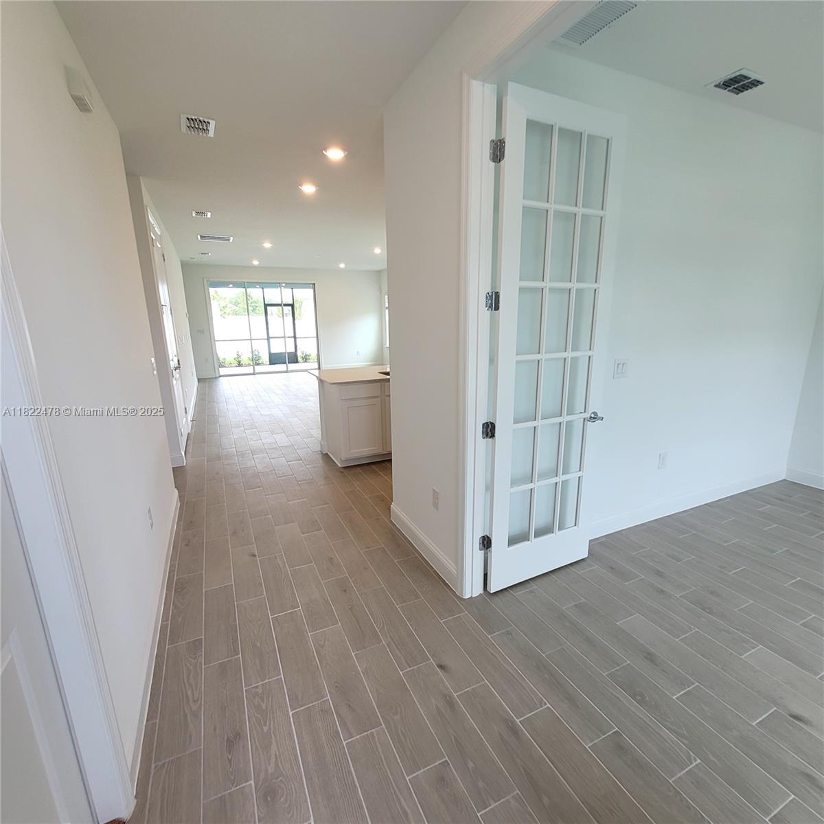 4155 Acoma Drive Ormond Beach, FL 32174 - Photo 17 of 49 a view of entryway with wooden floor