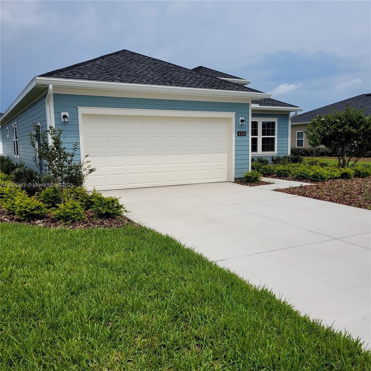 4155 Acoma Drive Ormond Beach, FL 32174 - Photo 2 of 49 a front view of house with a yard and garage