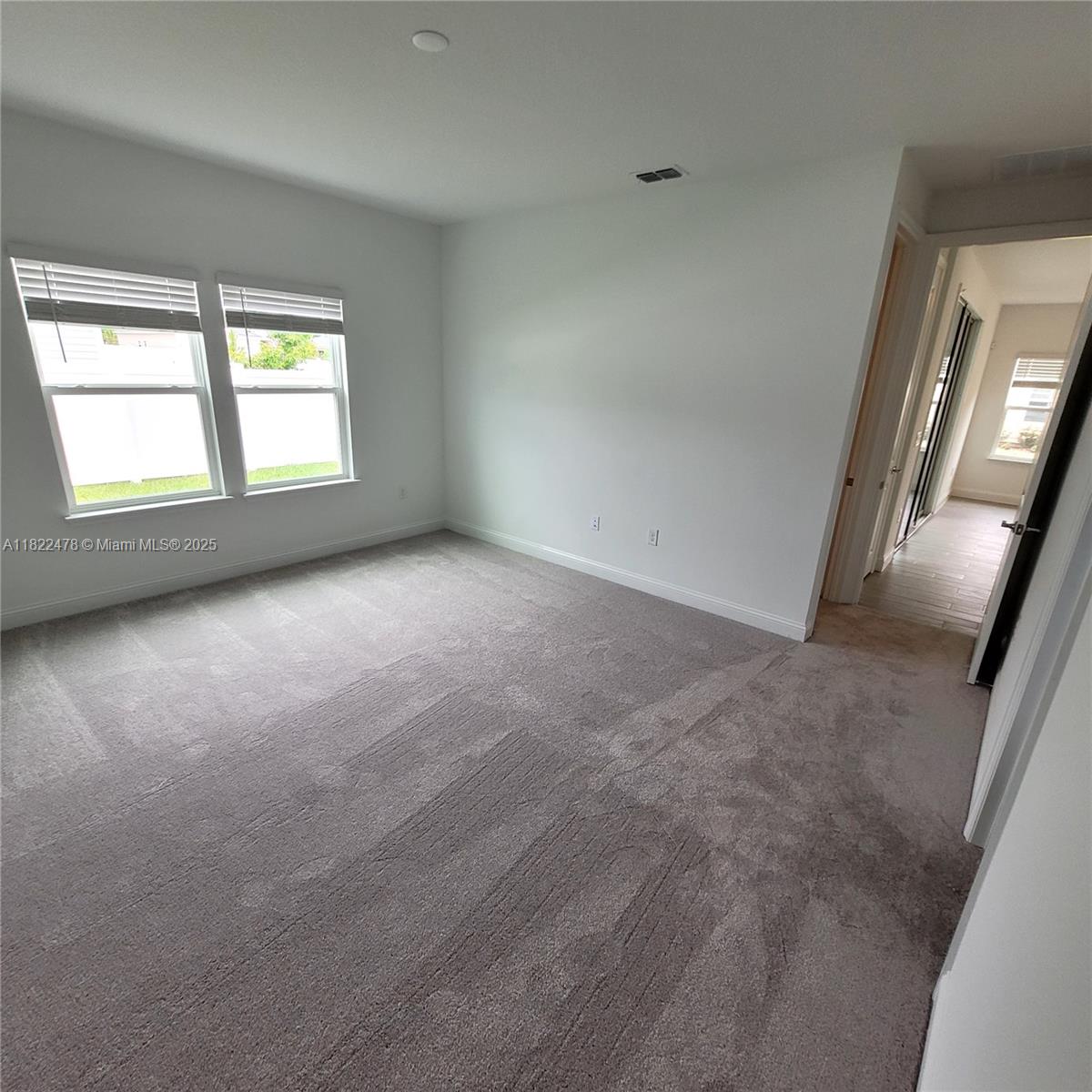 4155 Acoma Drive Ormond Beach, FL 32174 - Photo 37 of 49 an empty room with windows and entrance