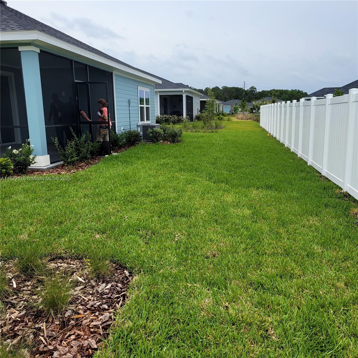 4155 Acoma Drive Ormond Beach, FL 32174 - Photo 9 of 49 a view of a porch in front of a house with plants and wooden fence