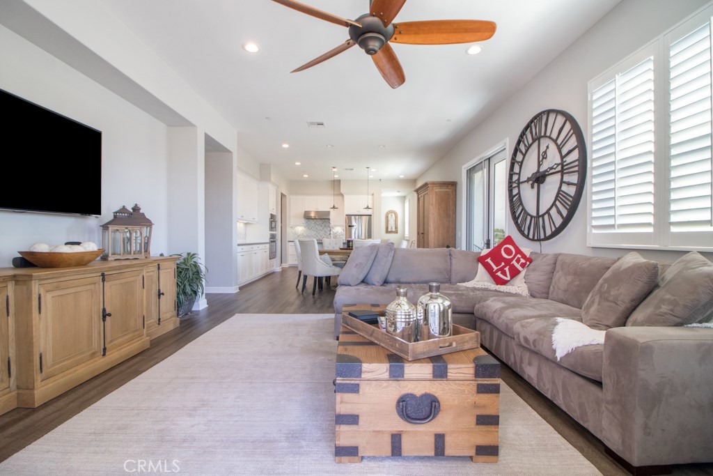 157 Follyhatch Irvine, CA 92618 - Photo 13 of 44 a living room with furniture a flat screen tv and a window