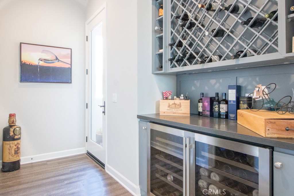 157 Follyhatch Irvine, CA 92618 - Photo 3 of 44 a kitchen with stainless steel appliances granite countertop a refrigerator and wooden cabinets