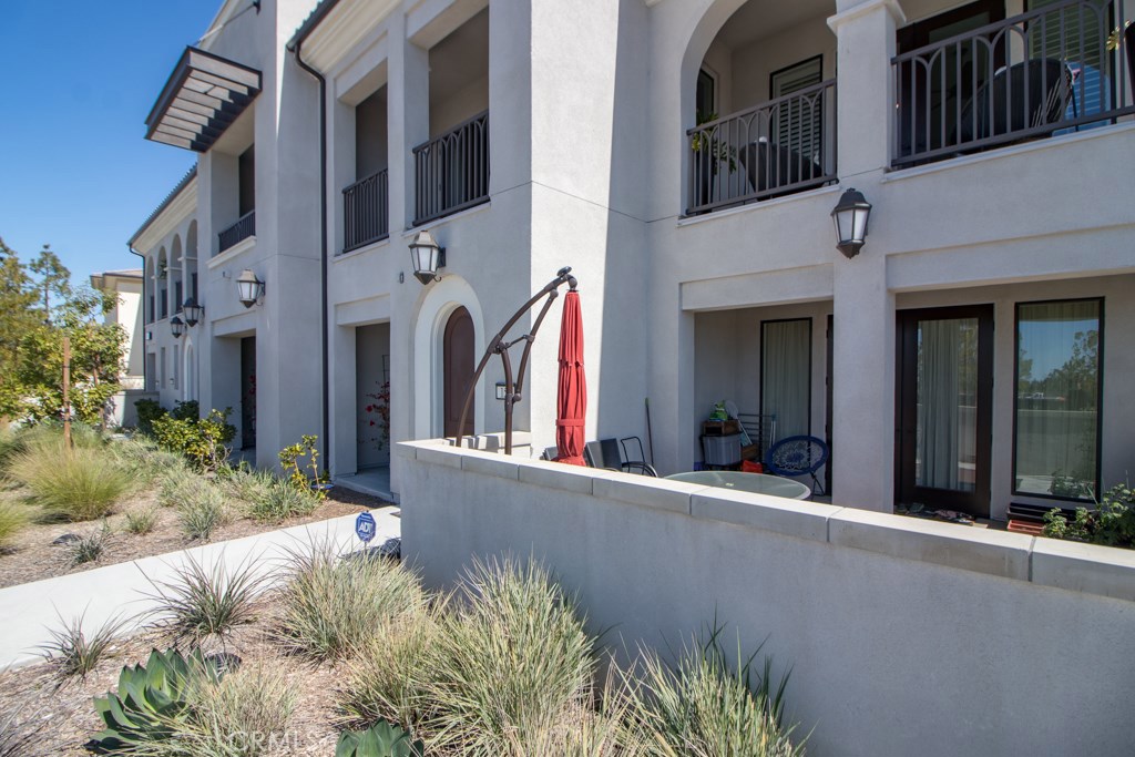 157 Follyhatch Irvine, CA 92618 - Photo 42 of 44 a view of a building with a flower garden