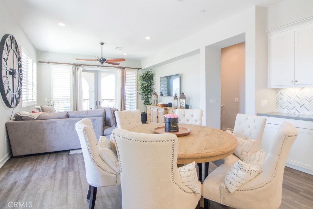 157 Follyhatch Irvine, CA 92618 - Photo 8 of 44 a view of a dining room with furniture window and wooden floor
