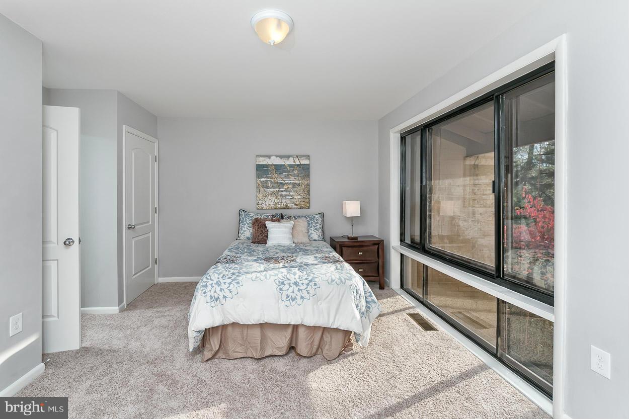 3 Cross Keys Road Baltimore, MD 21210 - Photo 16 of 29 a bedroom with a bed and a large window