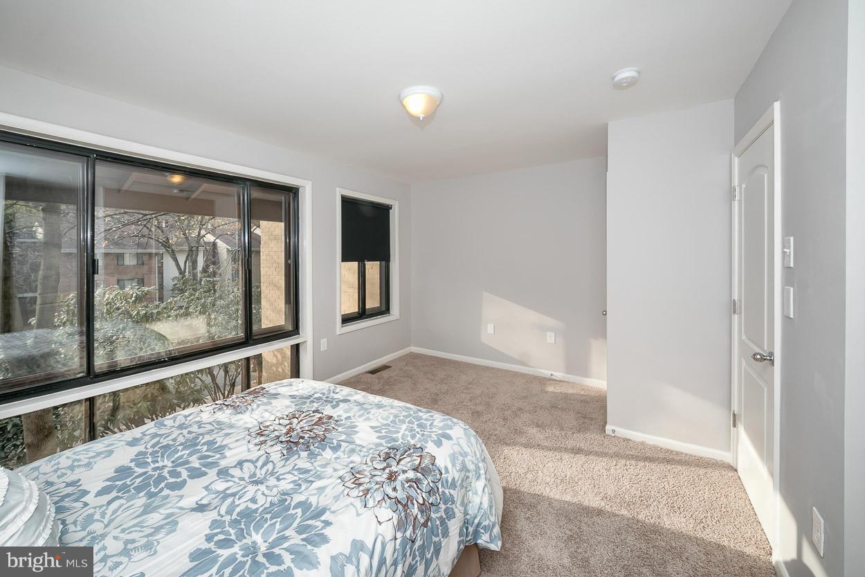 3 Cross Keys Road Baltimore, MD 21210 - Photo 17 of 29 a bedroom with a large bed and a large window