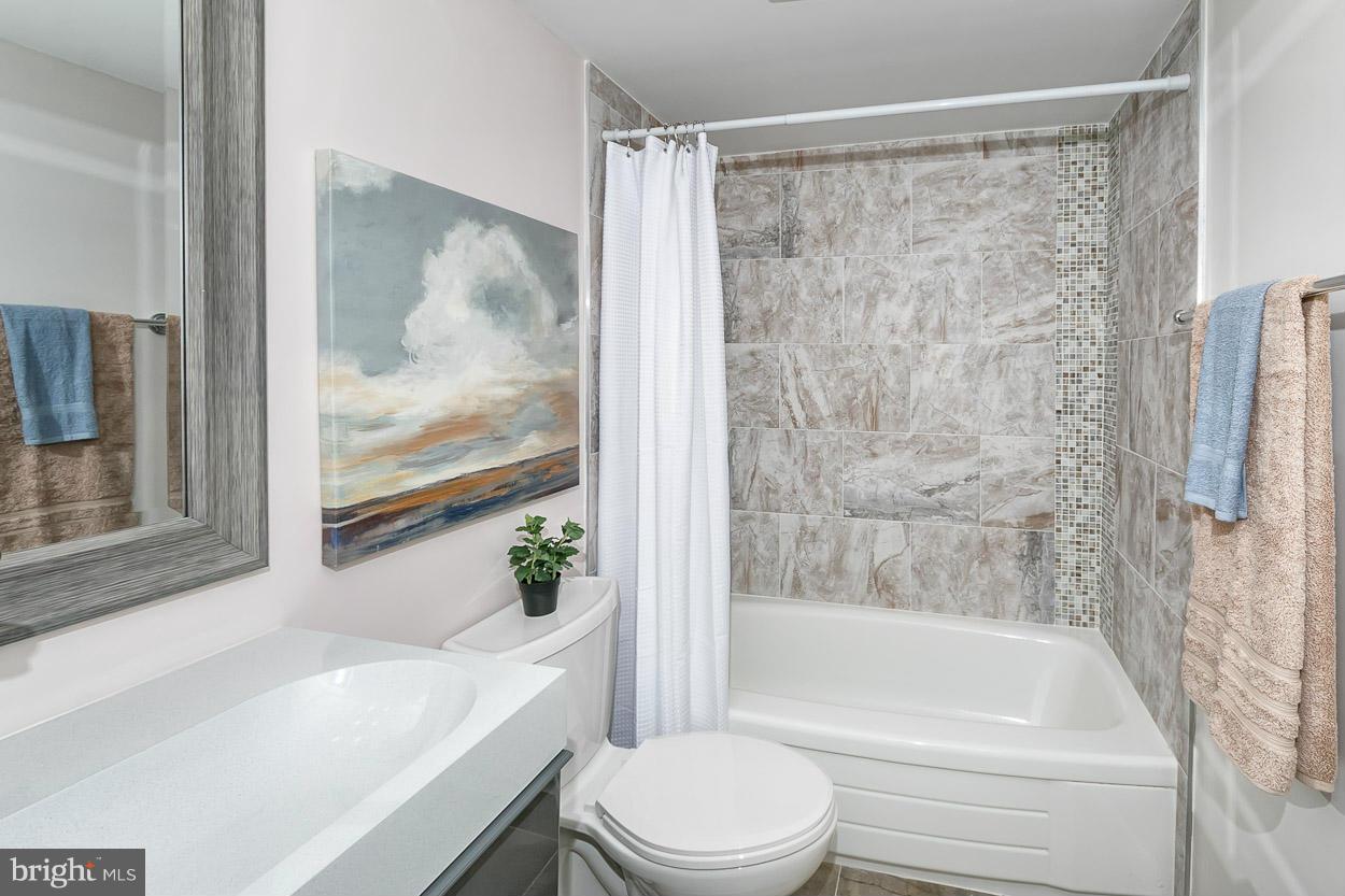 3 Cross Keys Road Baltimore, MD 21210 - Photo 23 of 29 a bathroom with a bathtub toilet and sink