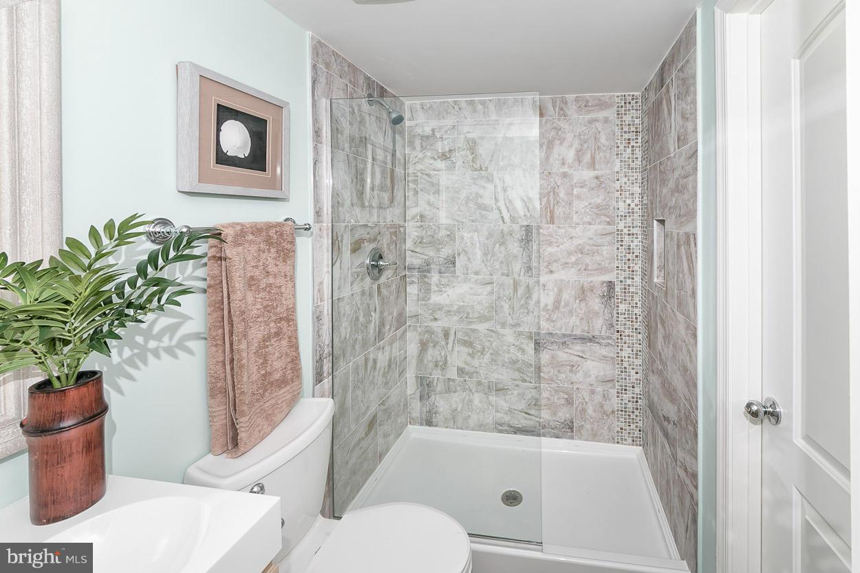 3 Cross Keys Road Baltimore, MD 21210 - Photo 5 of 29 a bathroom with a toilet and a shower