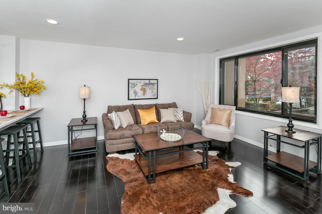 3 Cross Keys Road Baltimore, MD 21210 - Photo 6 of 29 a living room with furniture and a large window
