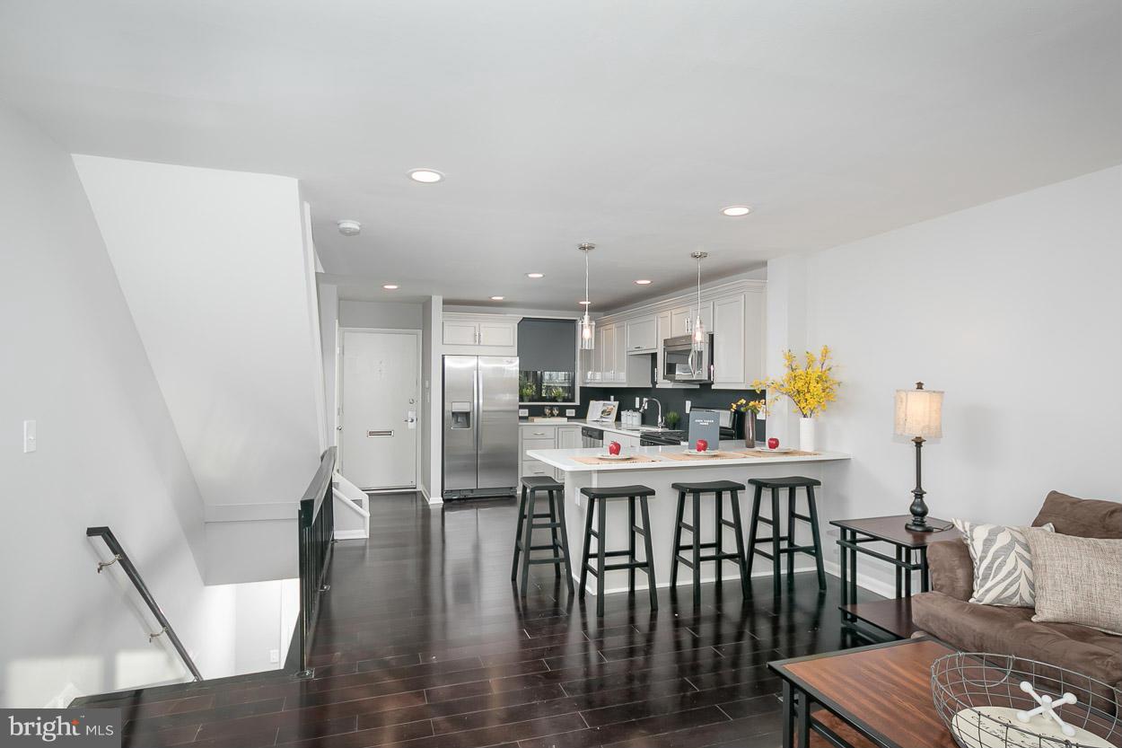 3 Cross Keys Road Baltimore, MD 21210 - Photo 9 of 29 a view of a dining room with furniture wooden floor and kitchen