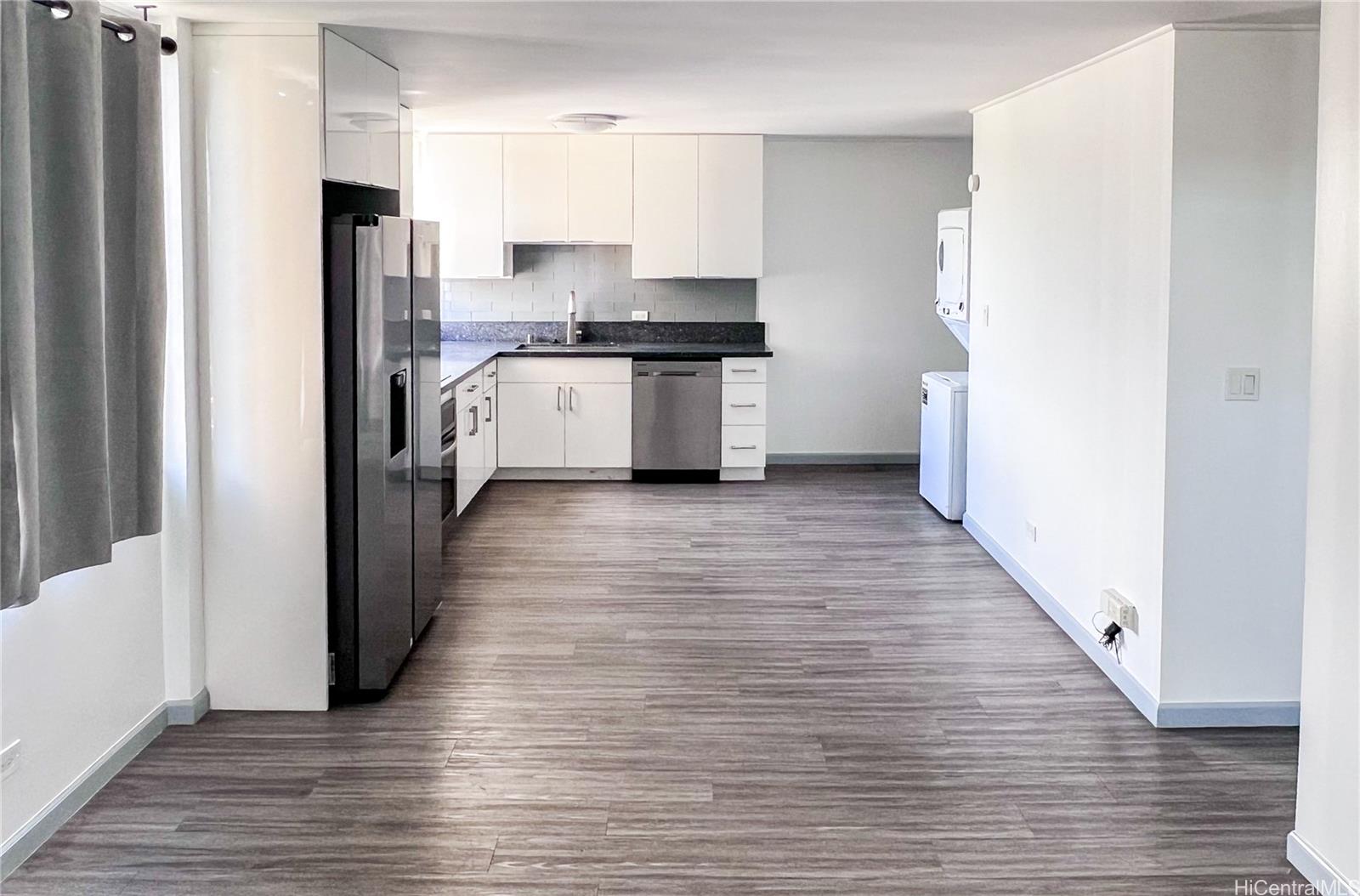 5210 Likini Street, Unit 901 Honolulu, HI 96818 - Photo 4 of 16 a kitchen with stainless steel appliances a refrigerator and a stove top oven