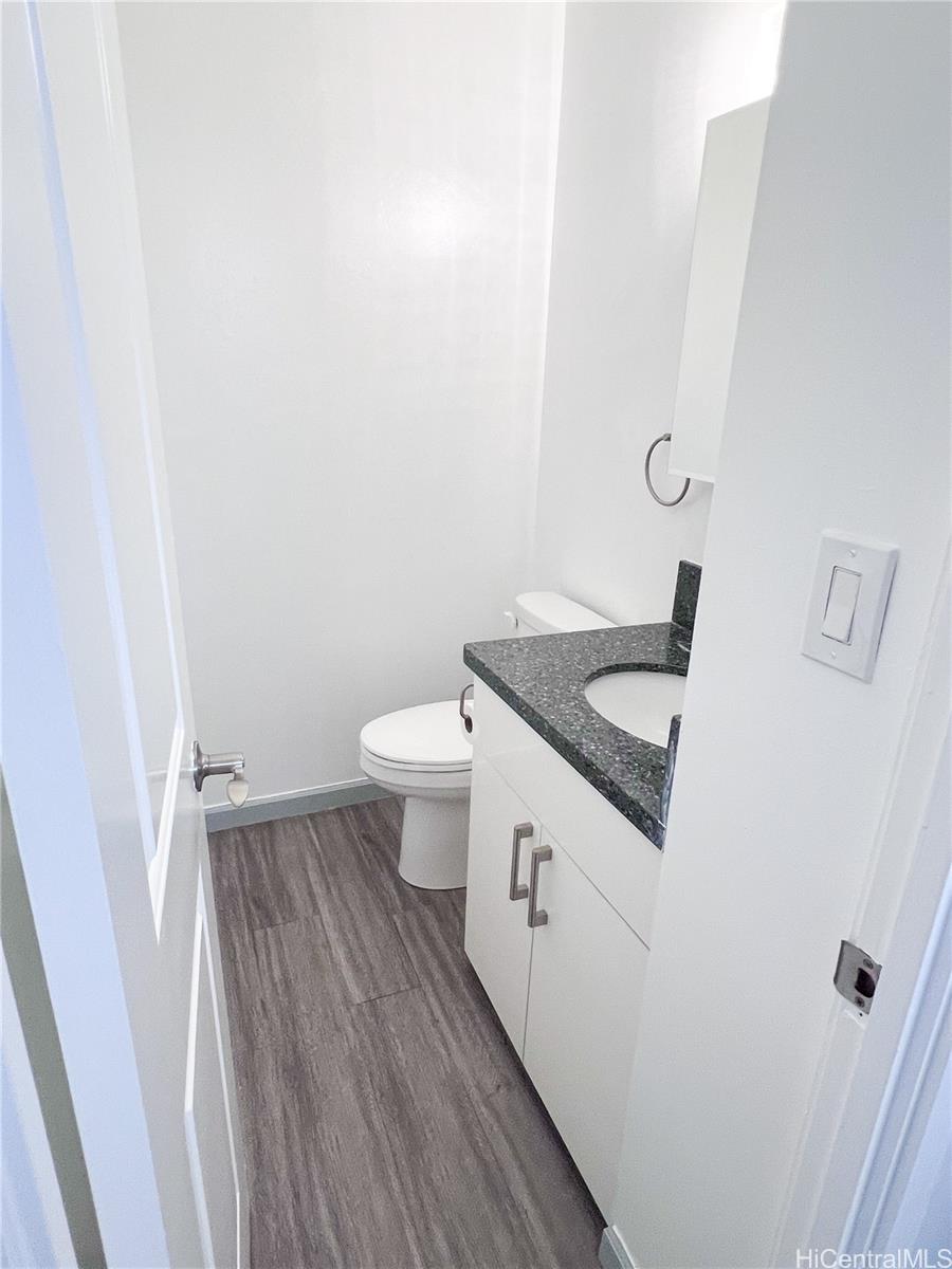 5210 Likini Street, Unit 901 Honolulu, HI 96818 - Photo 8 of 16 a bathroom with a sink and toilet