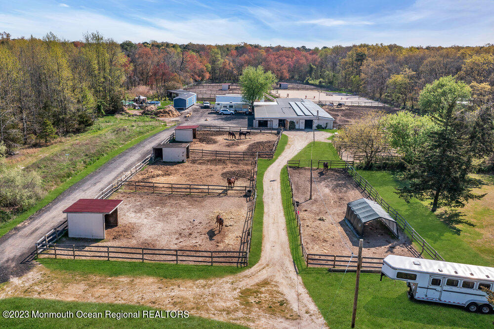 1064 Maxim Southard Road Howell, NJ 07731 - Photo 27 of 40 an aerial view of a house with a garden and lake view