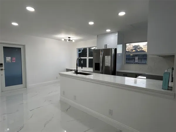 a view of a living room with furniture