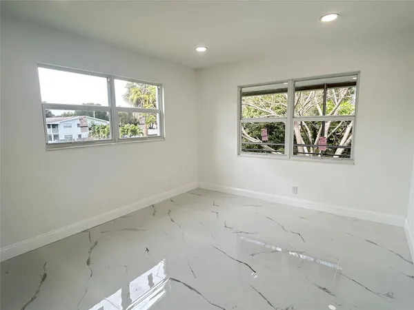 an empty room with windows