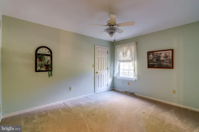 a view of a big room with windows