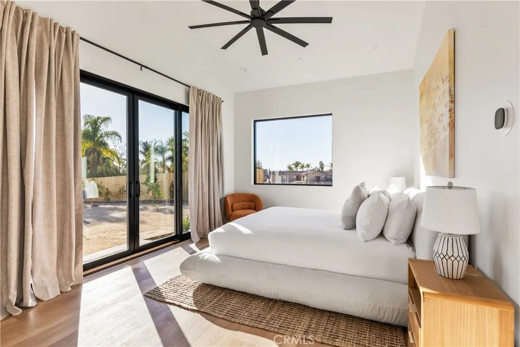 39241 Corte Venture Temecula, CA 92590 - Photo 20 of 49 a bedroom with a large bed and a window