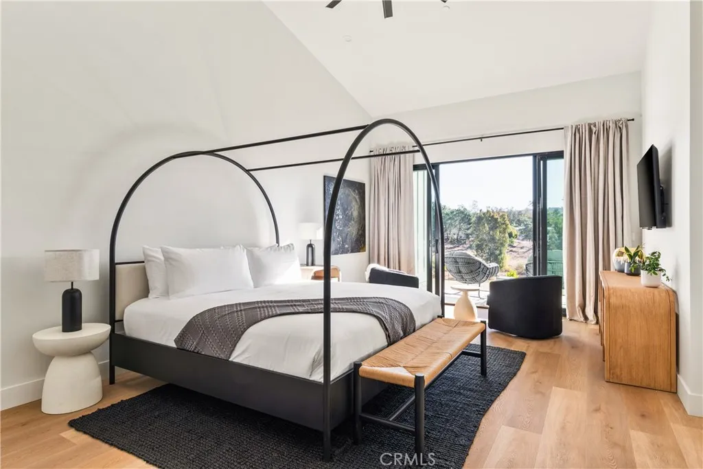 39241 Corte Venture Temecula, CA 92590 - Photo 24 of 49 a bedroom with a bed and a large window