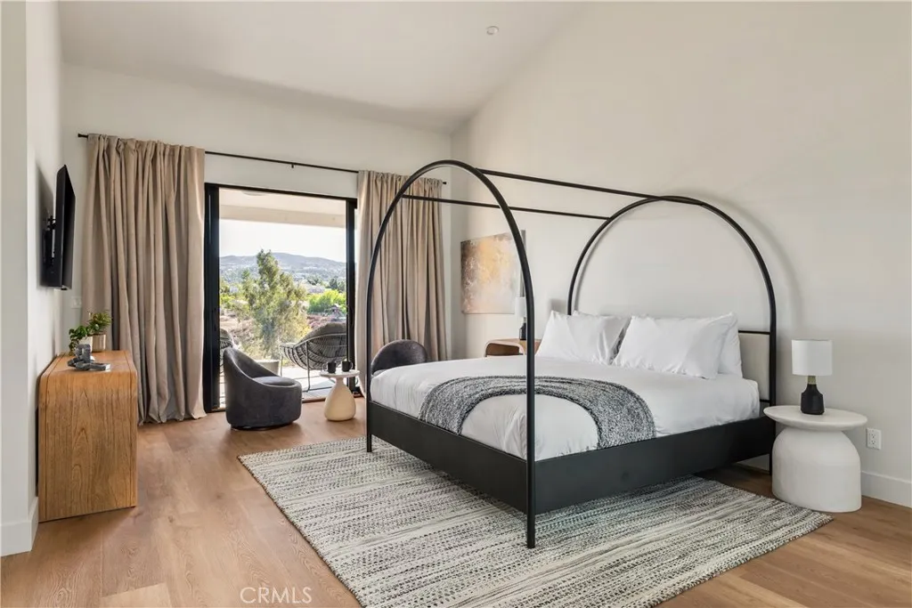 39241 Corte Venture Temecula, CA 92590 - Photo 28 of 49 a bedroom with bed and a large window