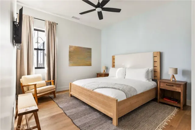 a bedroom with a bed and a chair