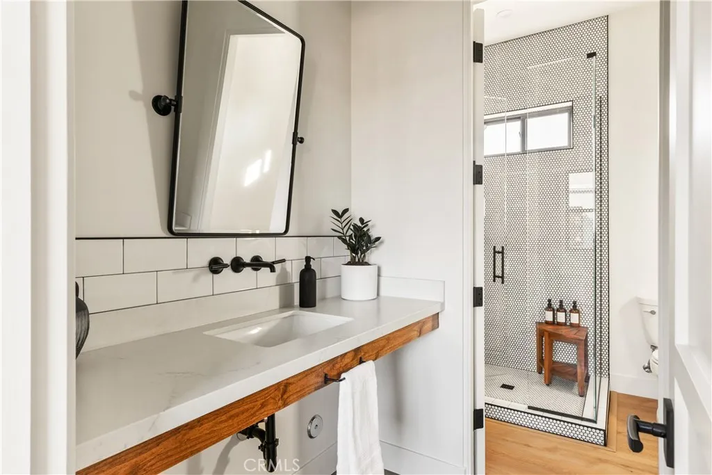 39241 Corte Venture Temecula, CA 92590 - Photo 40 of 49 a bathroom with a sink and a mirror