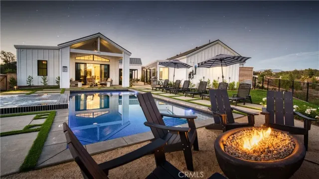 a view of a chairs and table in a patio