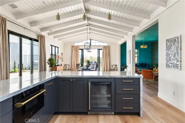 a large room with a large window and cabinets