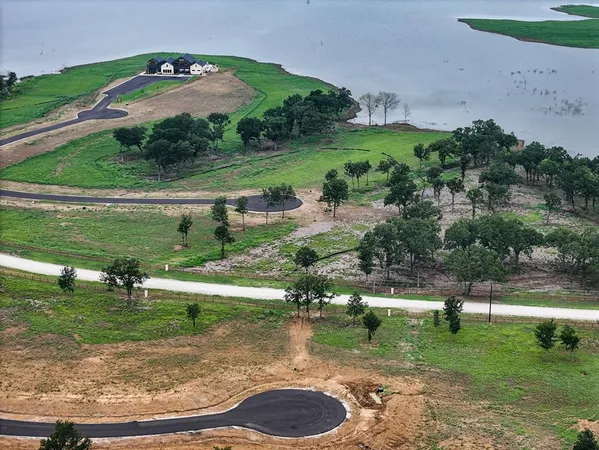 a view of a lake with a yard