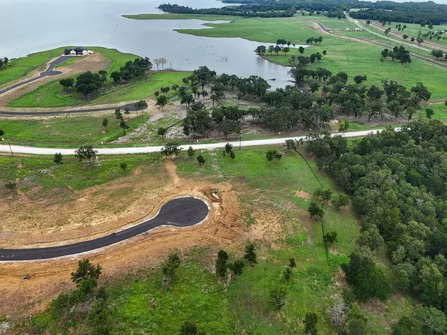 a view of a lake with a yard