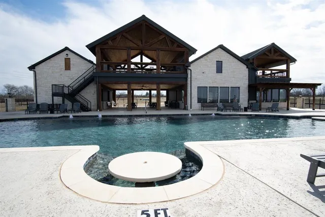 a view of a house with a swimming pool