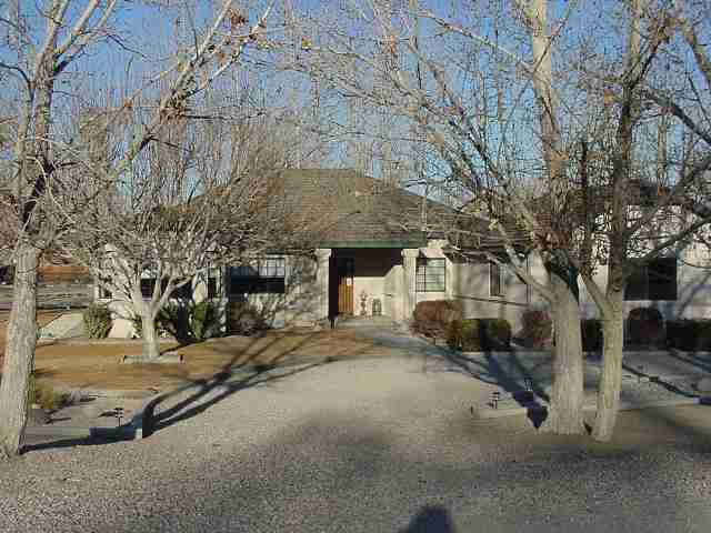2574 Rice Road Fallon, NV 89406 - Photo 1 of 4 a view of a house with a yard and garage