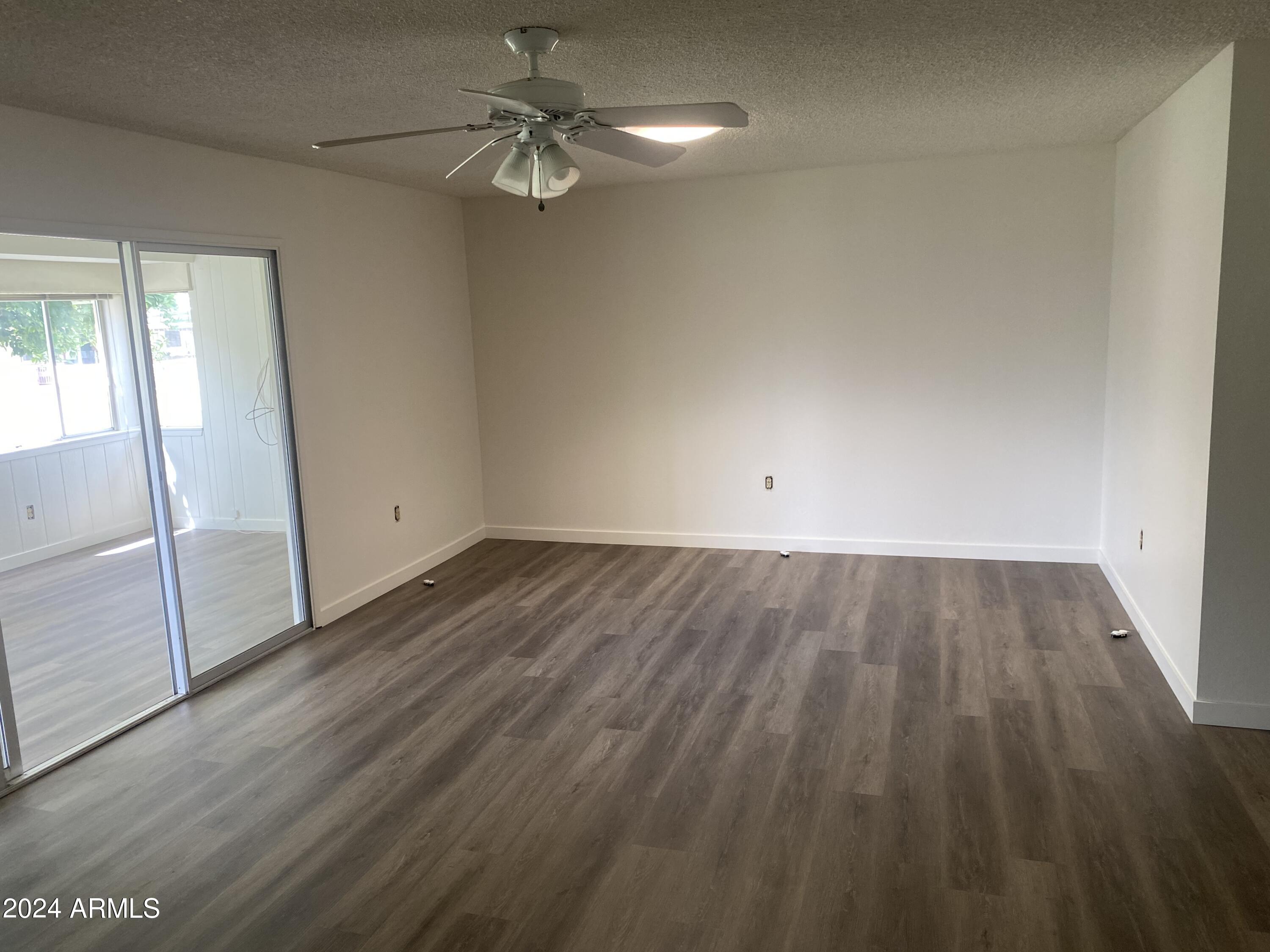 10127 West Mountain View Road Sun City, AZ 85351 - Photo 6 of 14 family room