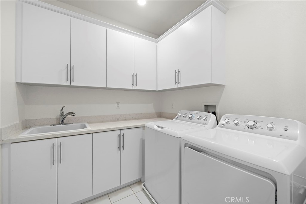 144 Paramount Irvine, CA 92618 - Photo 21 of 43 a utility room with dryer and washer