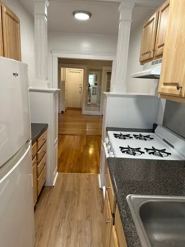 a kitchen with a stove and a refrigerator