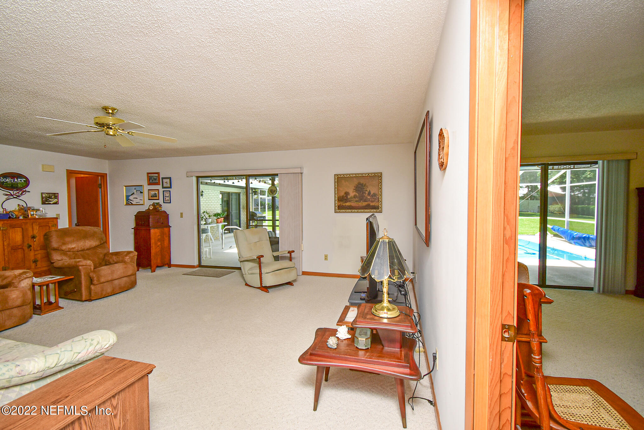 105 Tallow Road Pomona Park, FL 32181 - Photo 12 of 55 a living room with furniture a flat screen tv and a window