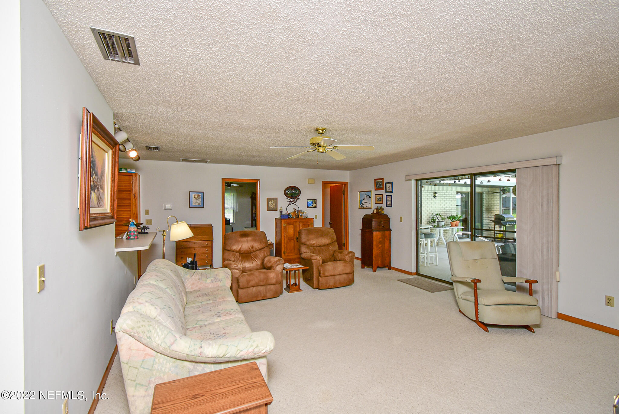 105 Tallow Road Pomona Park, FL 32181 - Photo 13 of 55 a living room with furniture and a table