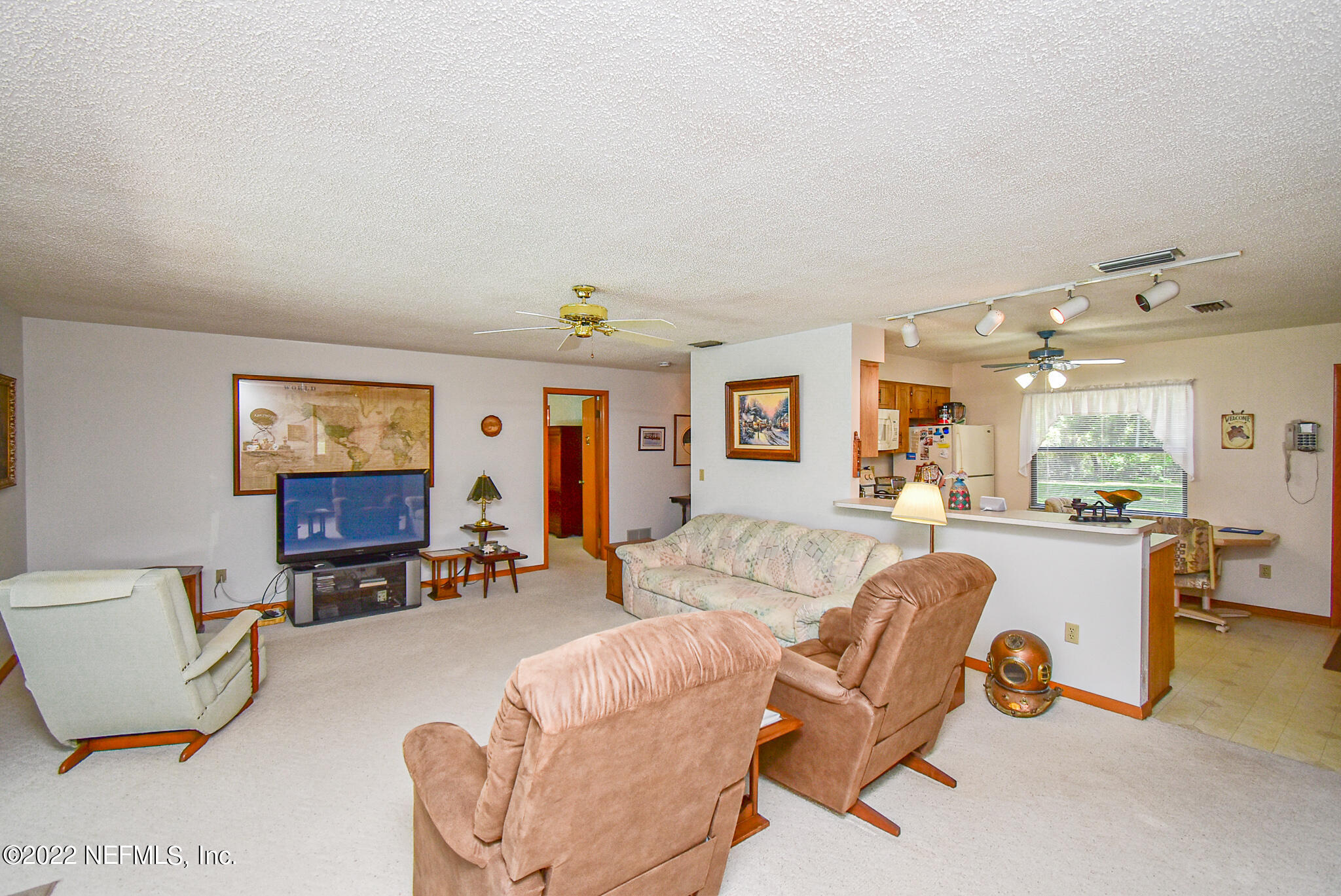 105 Tallow Road Pomona Park, FL 32181 - Photo 15 of 55 a living room with furniture and wooden floor