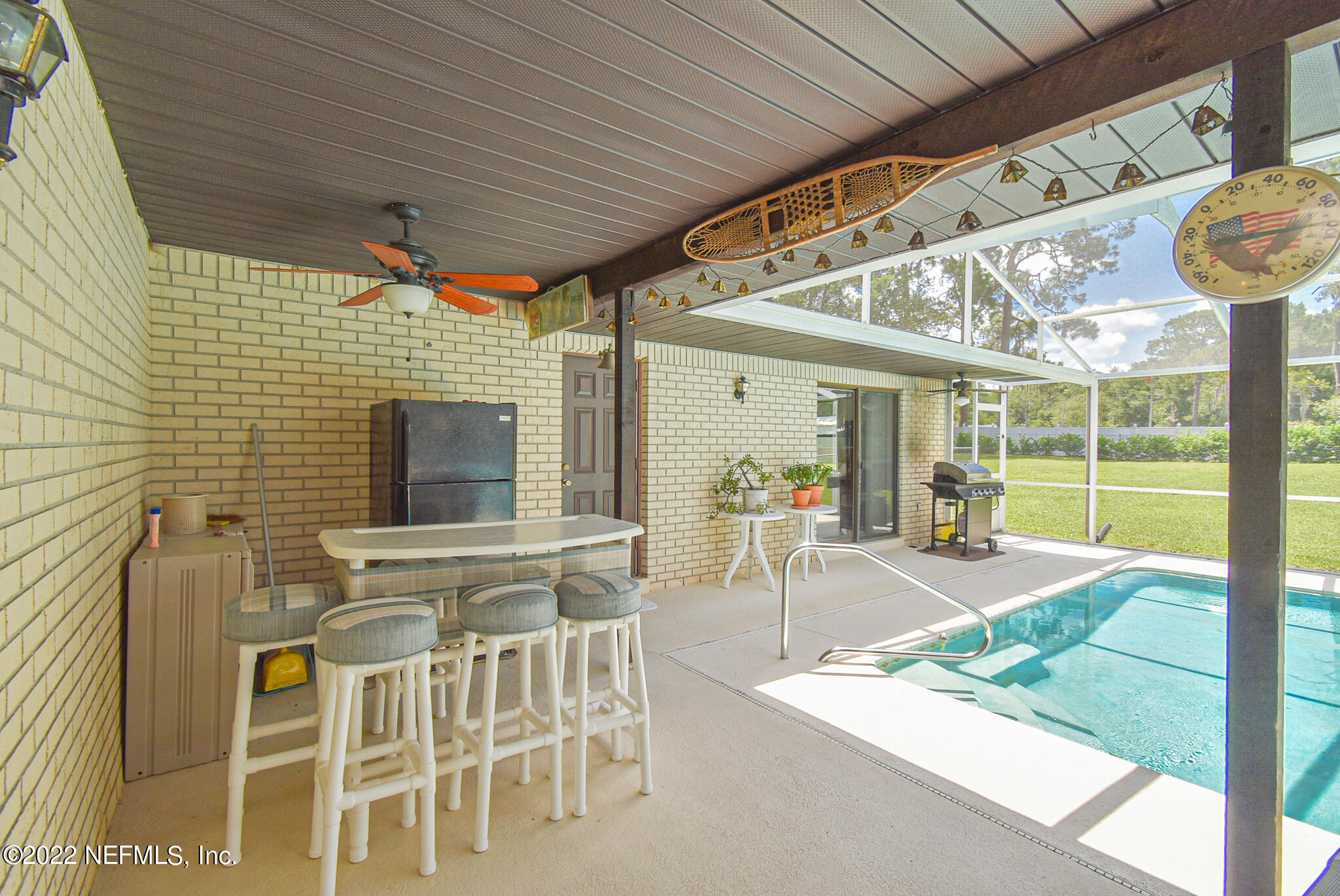 105 Tallow Road Pomona Park, FL 32181 - Photo 17 of 55 a view of a patio with table and chairs
