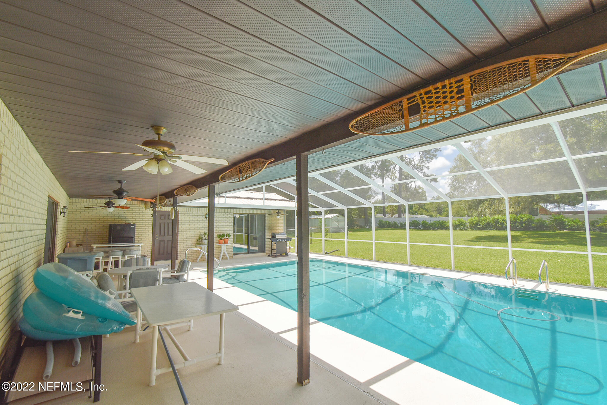 105 Tallow Road Pomona Park, FL 32181 - Photo 19 of 55 a view of a living room and balcony