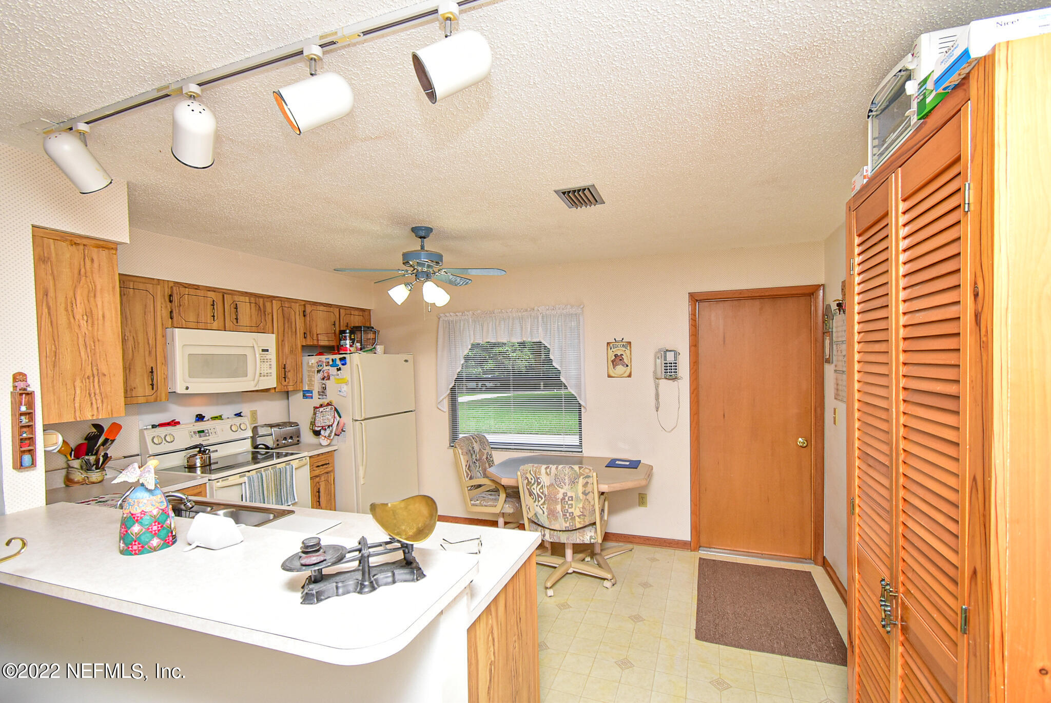 105 Tallow Road Pomona Park, FL 32181 - Photo 24 of 55 a view of a livingroom with furniture and a chandelier