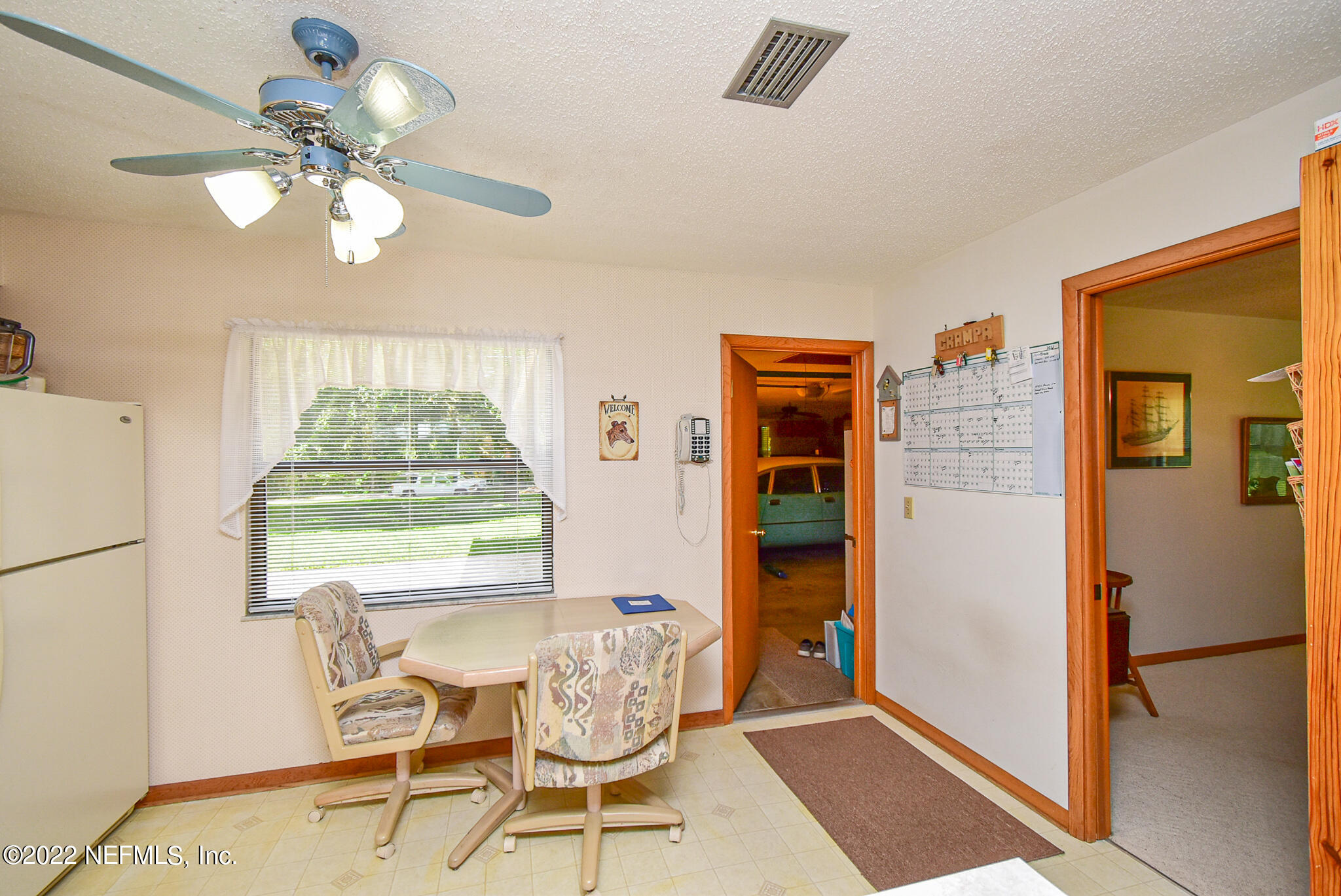 105 Tallow Road Pomona Park, FL 32181 - Photo 25 of 55 a view of a dining room with furniture and a window