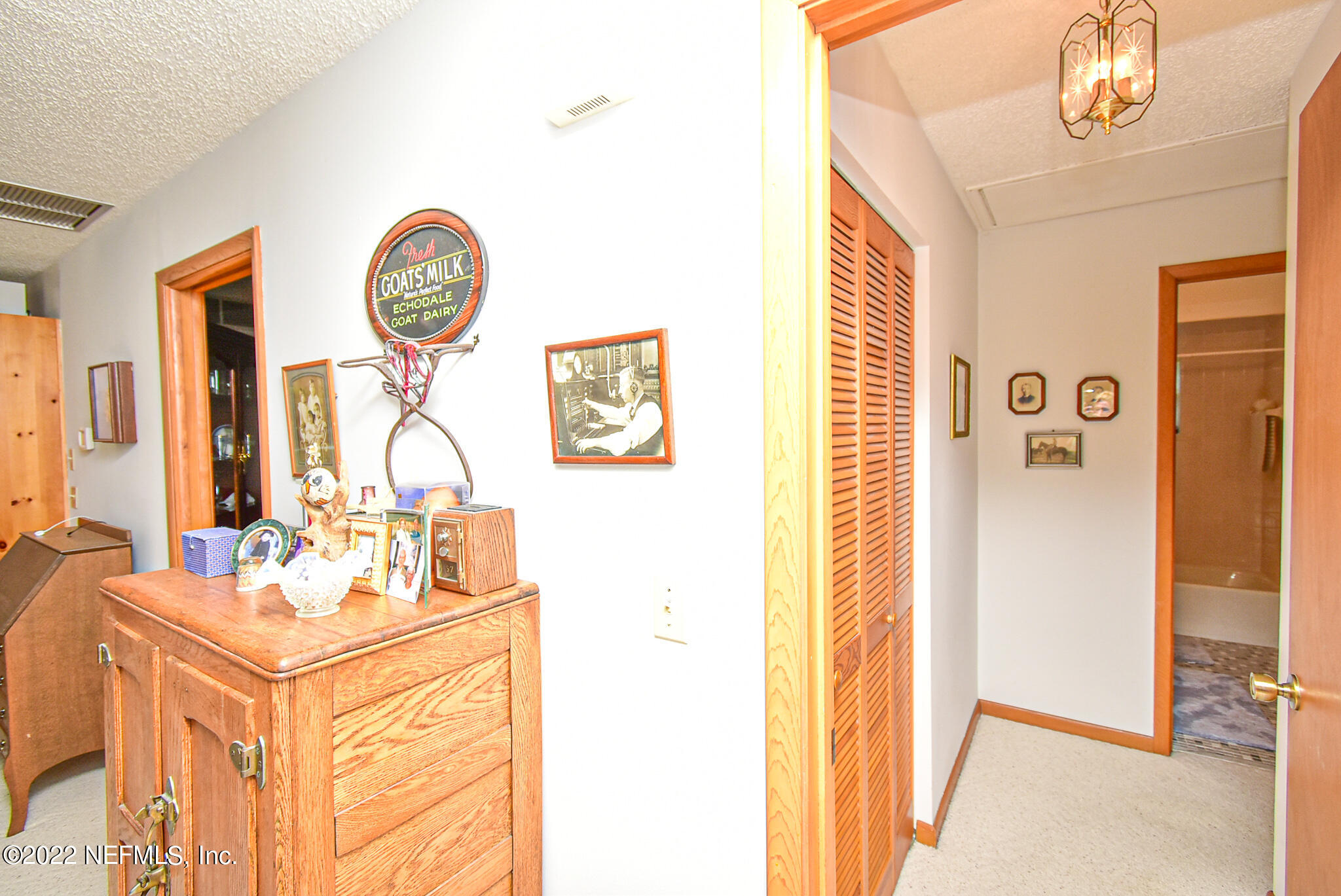 105 Tallow Road Pomona Park, FL 32181 - Photo 30 of 55 a bathroom with a sink mirror and a shower