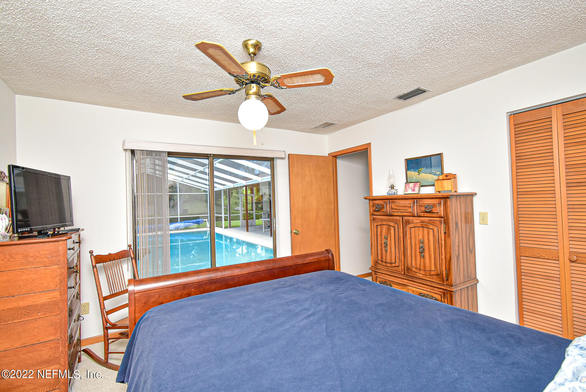 105 Tallow Road Pomona Park, FL 32181 - Photo 32 of 55 a bedroom with a bed and wooden floor