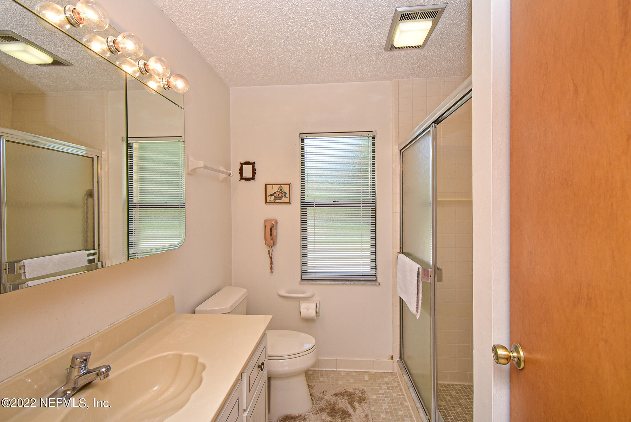105 Tallow Road Pomona Park, FL 32181 - Photo 35 of 55 a bathroom with a sink a toilet and shower