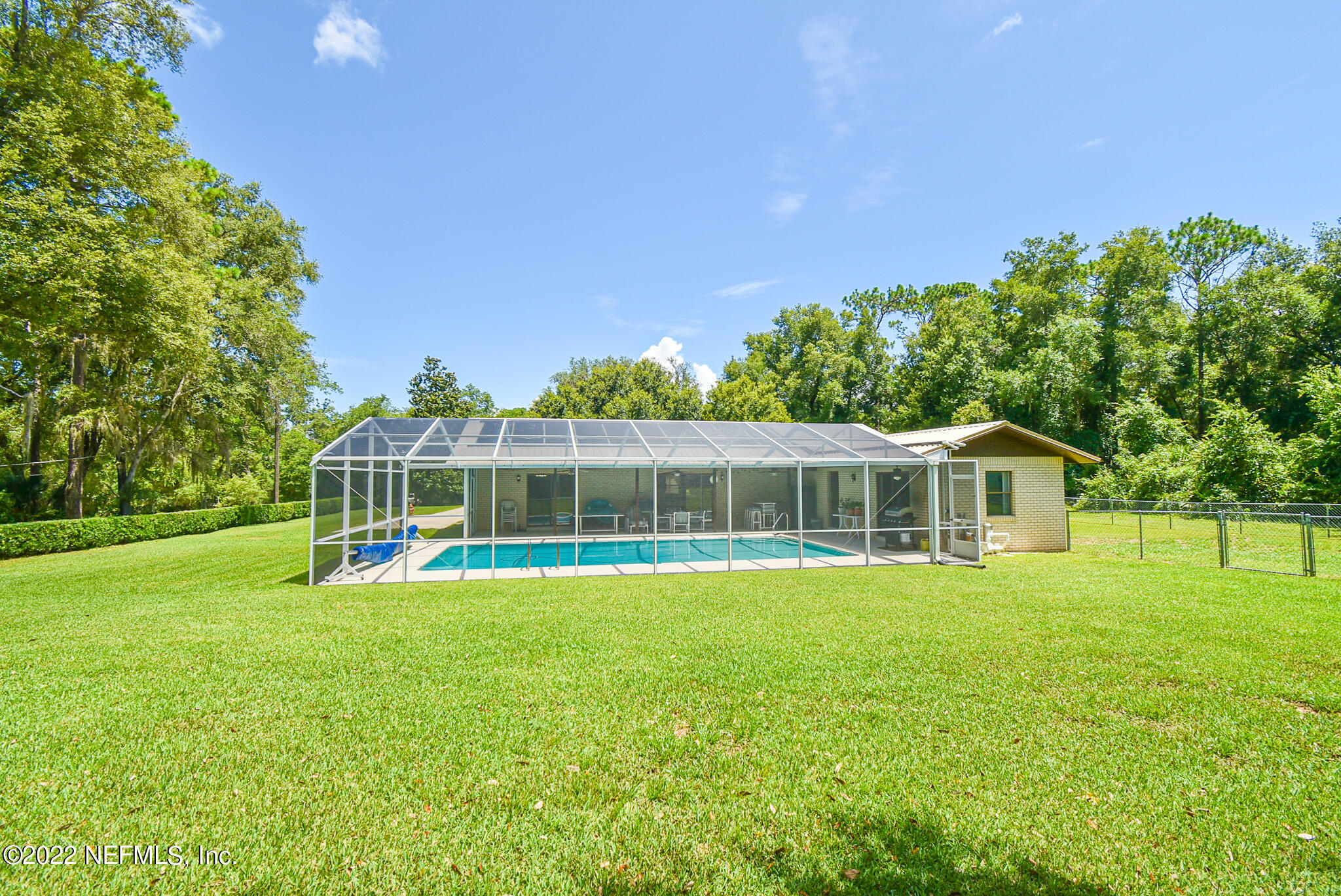 105 Tallow Road Pomona Park, FL 32181 - Photo 47 of 55 a view of a house with a yard and sitting area